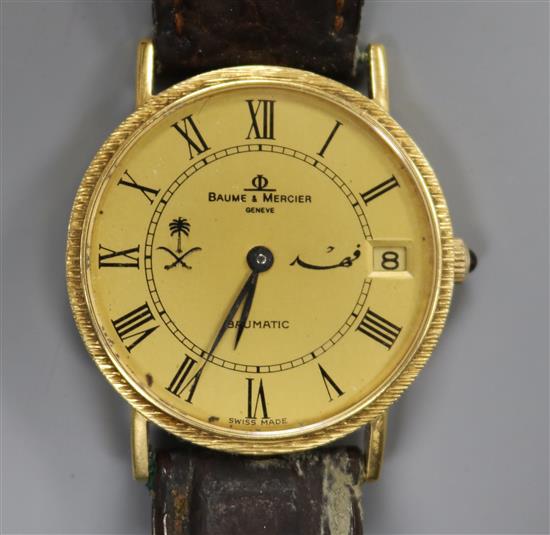 A gentlemans 18ct gold Baume & Mercier Baumatic wrist watch.